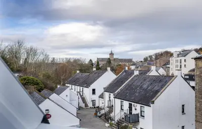 an aerial view of a town with white houses at The Unique Cathedral Hideaway in Stirling