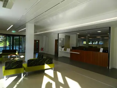 a lobby with two chairs and a waiting room at Willow Court in Stirling