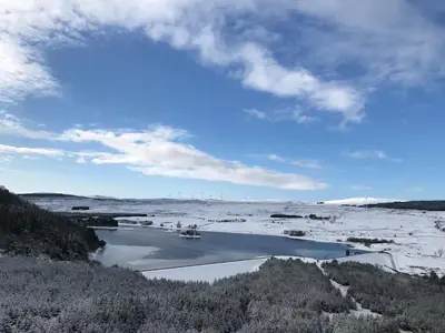 a view of a river with snow on the ground at Foresters 4 Bedroom Apartment in Cambusbarron