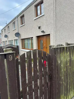 a wooden fence in front of a house at Modern & Cosy 3 Bedroom Inverkeithing home- Ideal for Edinburgh Dunfermline & St Andrews with Free Parking in Inverkeithing