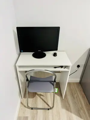 a white desk with a computer monitor on top of it at Modern Flat in Glasgow City FREE Parking & Wifi in Glasgow