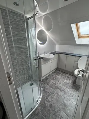 a bathroom with a shower and a sink and a toilet at Caplawhead in Armadale