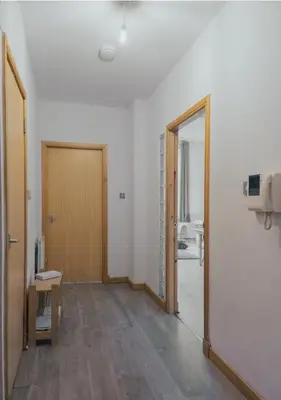 an empty room with a door and a hallway at 2 bed Renfield st City Center in Glasgow