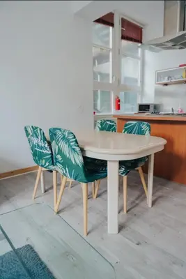 a table and two chairs in a kitchen at 2 bed Renfield st City Center in Glasgow