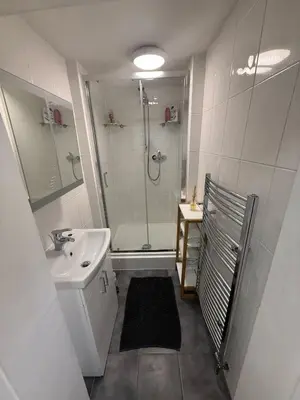 a bathroom with a shower and a sink at Flat in Central Edinburgh Old town in Edinburgh