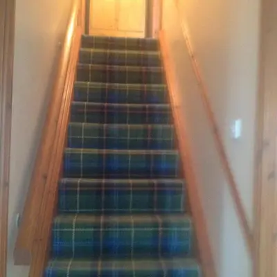 a flight of stairs in a house with at Beachview Cottage Co. Antrim in Cushendun