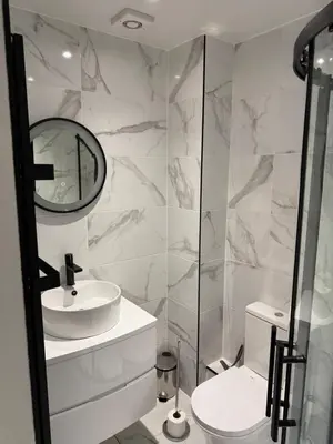 a white bathroom with a sink and a mirror at Dunfermline 2 Bed Flat Fully Furnished in Dunfermline