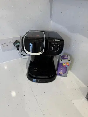 a black coffee maker sitting on top of a counter at Dunfermline 2 Bed Flat Fully Furnished in Dunfermline