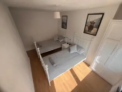 an overhead view of a bedroom with a bed at Mitchell House in Bellshill