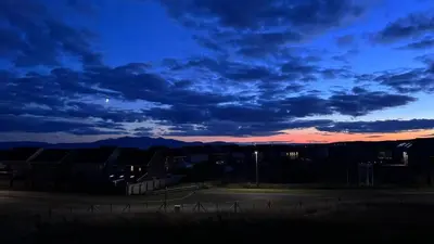 a view of a sunset from a parking lot at West Coast Home From Home in Stevenston