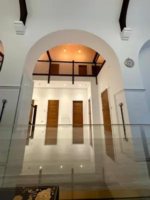 an empty room with an archway in a building at The Bell Tower in Bonnybridge