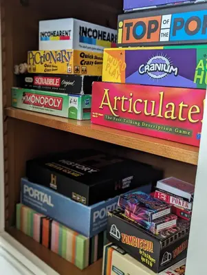 a stack of books on a book shelf at Mulberry Lodge Guest Suite - luxurious accommodation on West Highland Way in Drymen