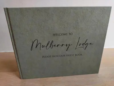 a book entitled mulberry layer tastes show our guest book at Mulberry Lodge Guest Suite - luxurious accommodation on West Highland Way in Drymen