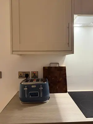 a suitcase sitting on a counter in a kitchen at West Riverside Farm in Stirling