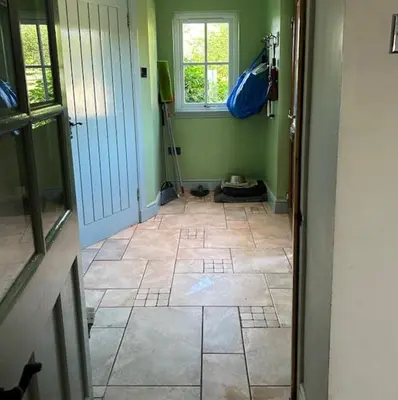 a room with a tiled floor and a room with a window at Sanda View, Isle of Arran in Sliddery
