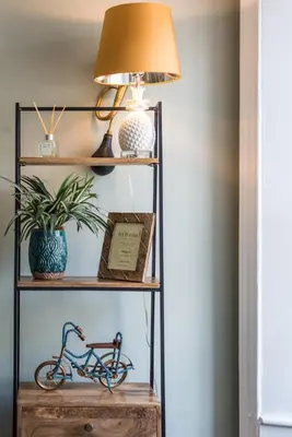 a lamp on a shelf with a bike on it at The Cobbled Rider in Edinburgh