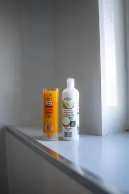 a bottle of disinfectant and a can of cleaner on a shelf at Camps Rigg Place in Livingston