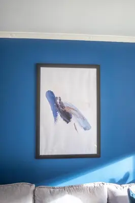 a picture of a fish on a blue wall at Camps Rigg Place in Livingston