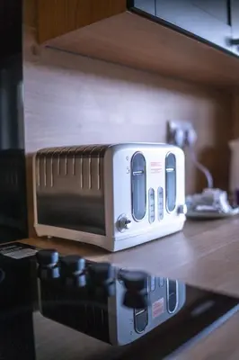 a toaster sitting on top of a kitchen counter at Camps Rigg Place in Livingston