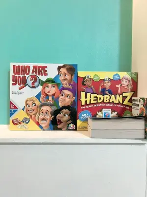 a shelf with two dora the explorer books and a heroz program at King Apartment in Falkirk
