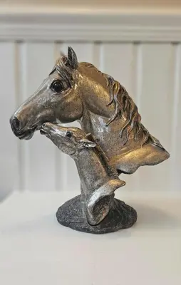 a bronze statue of a horse jumping over a deer at Spacious 3 Bed Home in Glasgow City With Free Parking in Glasgow