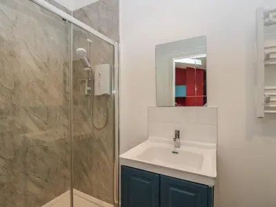 a bathroom with a sink and a shower at Tirlaggan Studio in Oban