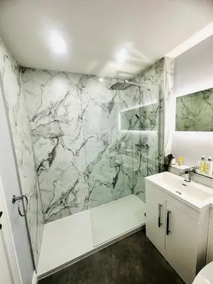 a bathroom with a marble shower and a sink at Kilmartin Court Apartments - No3 By The Sea & No2 With A View - free parking in Oban