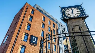 a clock on a tower in front of a building at For Students Only Clyde Court Glasgow in Glasgow