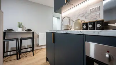 a kitchen with a sink and a counter top at For Students Only Clyde Court Glasgow in Glasgow
