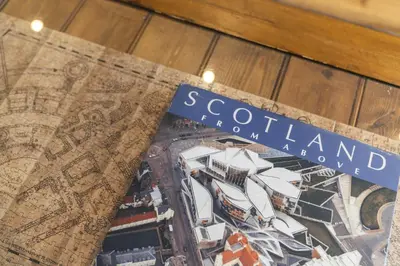 a book with the words scotlandland on the cover at Slateford 2 Bedroom Apartment - Edinburgh in Edinburgh