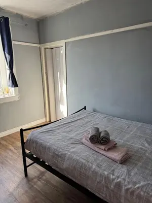 a bedroom with a bed with two towels on it at City break in Edinburgh