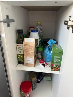 a shelf in a refrigerator filled with food and drinks at City break in Edinburgh