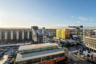 an aerial view of a city with cars and buildings at Stylish Studio Finnieston City Centre Free Parking in Glasgow