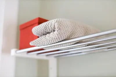 a white glove sitting on top of a shelf at Cosy City Centre Gem in Edinburgh