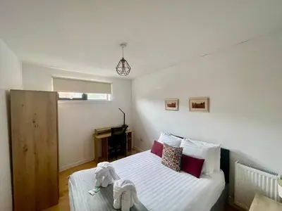 a bedroom with a bed with stuffed animals on it at Perfect Location in Heart of Glasgow West End - Pass the Keys in Glasgow