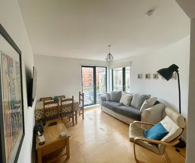 a living room with a couch and a table at Perfect Location in Heart of Glasgow West End - Pass the Keys in Glasgow