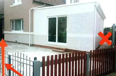 a house with two arrows pointing towards a fence at Modern Oasis , Edinburgh Airport near,8mi in Rosyth