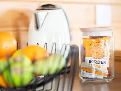 a jar of food sitting on a counter next to a blender at Chalet Loch Leven Lodge 21 by Interhome in Kinross