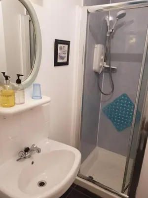 a bathroom with a sink and a shower at Maridon House in Oban