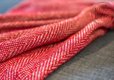 a close up of two red towels on a table at Oxford Apartment by Klass Living in Coatbridge