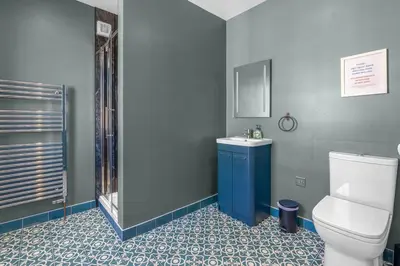a bathroom with a toilet and a sink and a shower at GuestReady - Unique hideaway in Edinburgh in Edinburgh