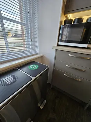 a kitchen with a counter with a microwave and a drawer at Ocean View 2 in Campbeltown