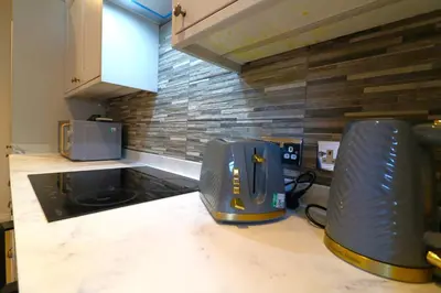 a kitchen with a toaster sitting on a counter at Signature - Cross House in Lanark