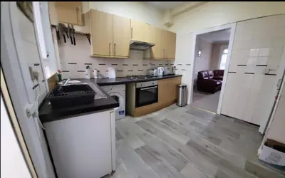 a kitchen with a sink and a counter top at Home to Home in Glasgow