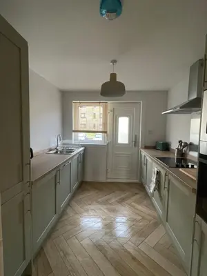 an empty kitchen with a sink and a window at 2 Bed on the Glasgow Green in Glasgow