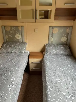 two beds sitting next to each other in a bedroom at Aspen Scenic 53 in Ardentinny