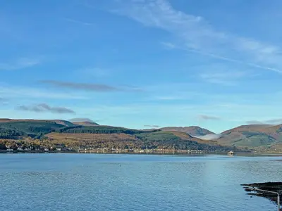 a view of a lake with mountains in the background at Holy Loch View in Strone