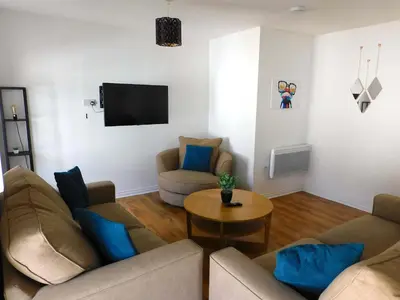 a living room with two couches and a table at No 5 - Modern 2 bedroom Apartment in Lanark Town Centre in Lanark
