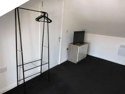 a room with a glass shelf and a television at No 7 - Modern 1 Bedroom Apartment in Lanark Town Centre in Lanark