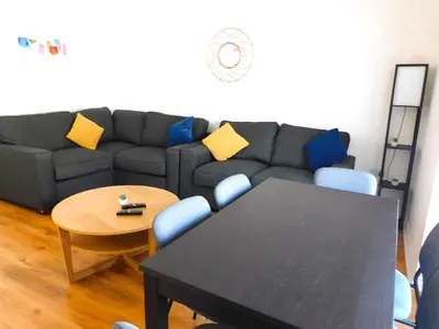 a living room with a couch and a table at No 9 - Modern 3 Bedroom Apartment in Lanark Town Centre in Lanark